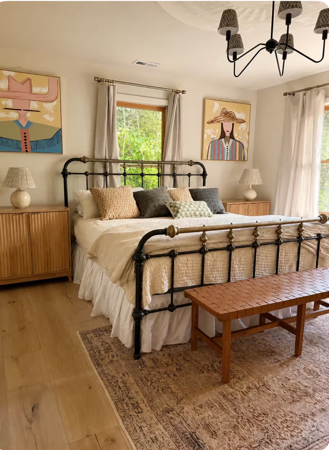 Bedroom with iron bed and large windows
